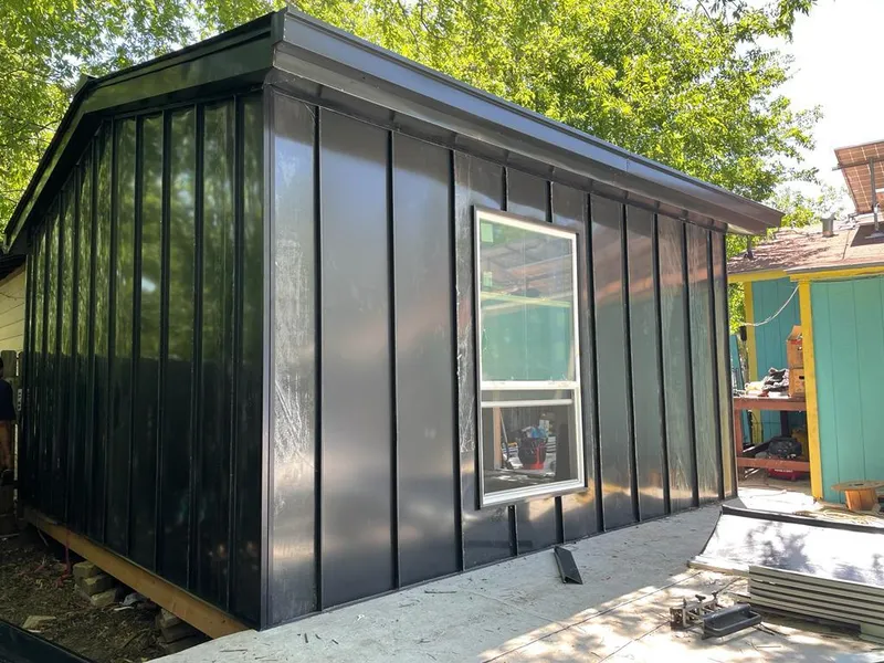 Black standing seam metal wall panels for Roof Inspection in Clover